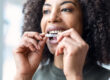 Woman wearing her aligners after getting invisalign raleigh nc