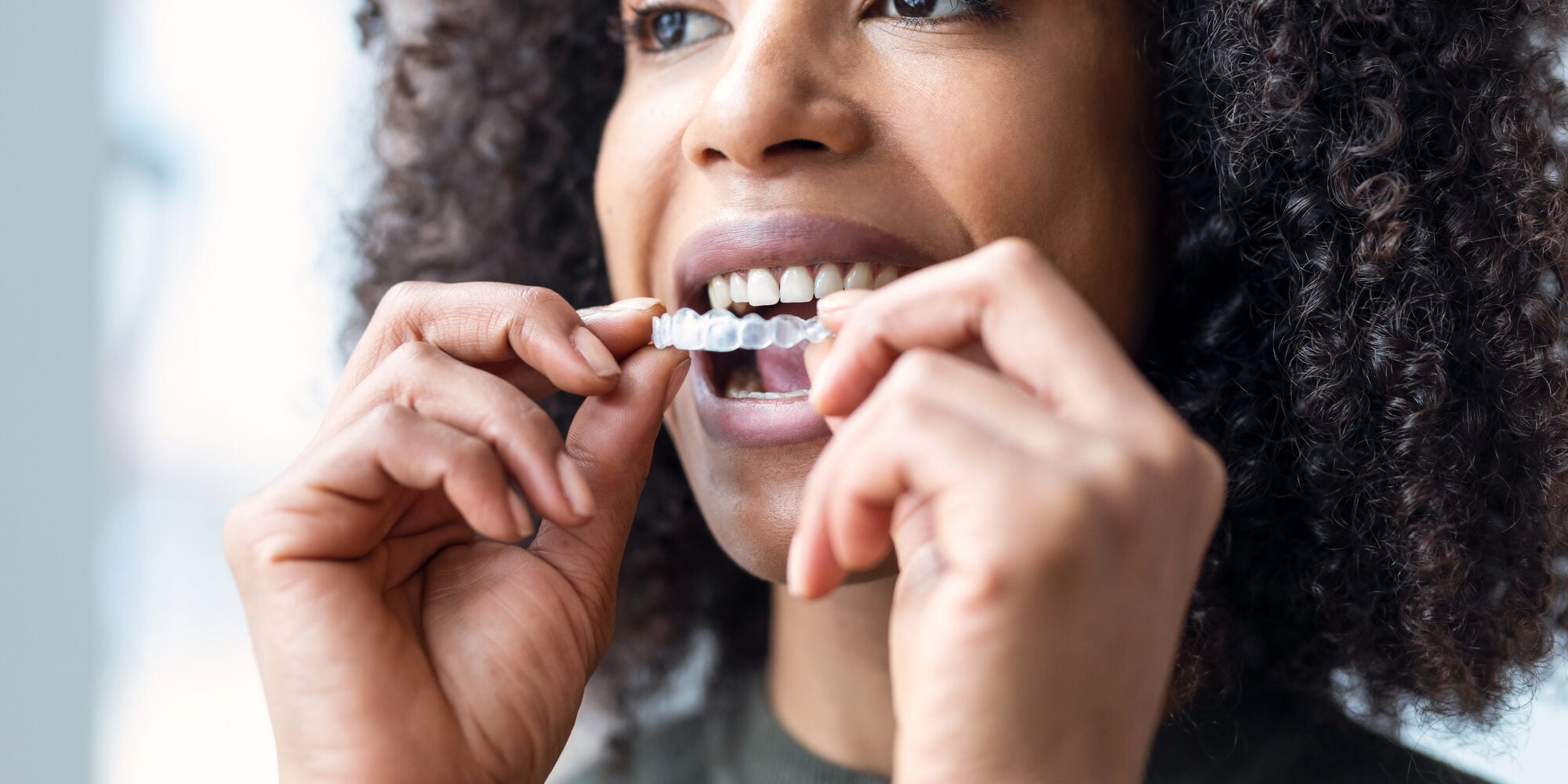 Woman-wearing-her-aligners-after-getting-invisalign-raleigh-nc Woman wearing her aligners after getting invisalign raleigh nc