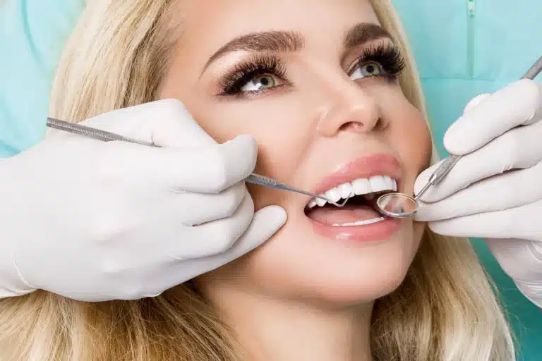 Girl checking her veneers raleigh nc