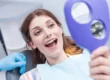 Woman smiling after oral surgery raleigh nc