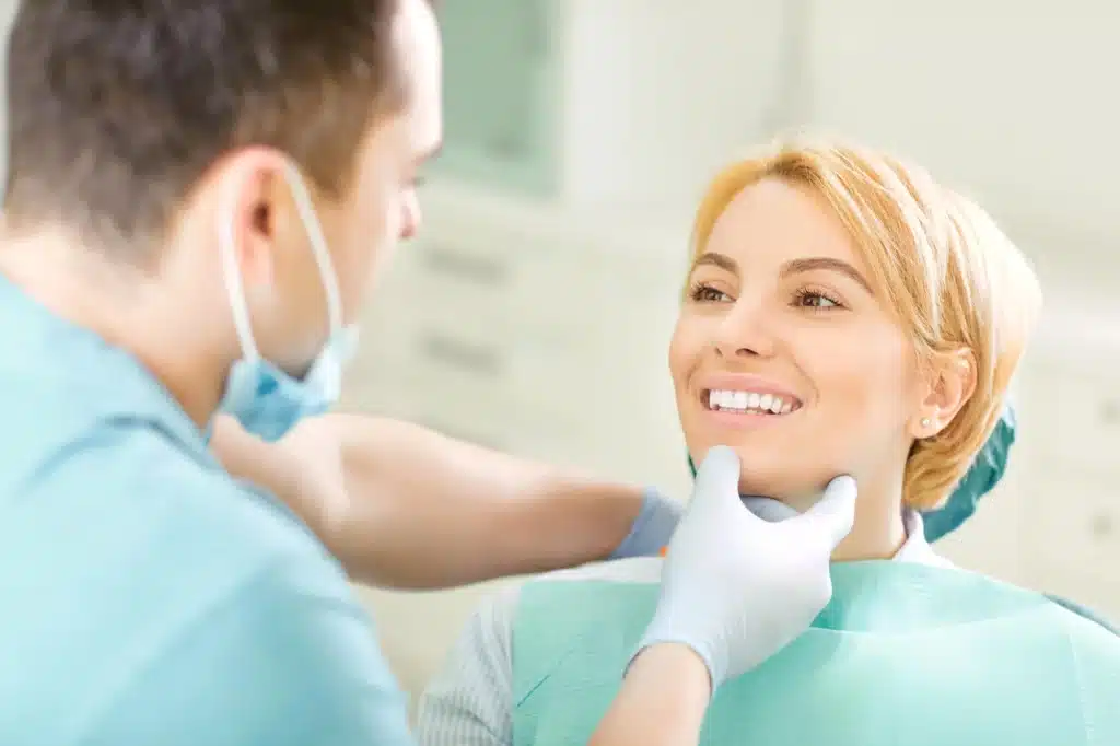 Woman-smiling-with-dental-crowns-raleigh